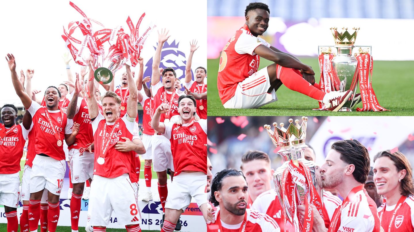 Arsenal players celebrate with the Premier League trophy after winning the 2025-26 title
