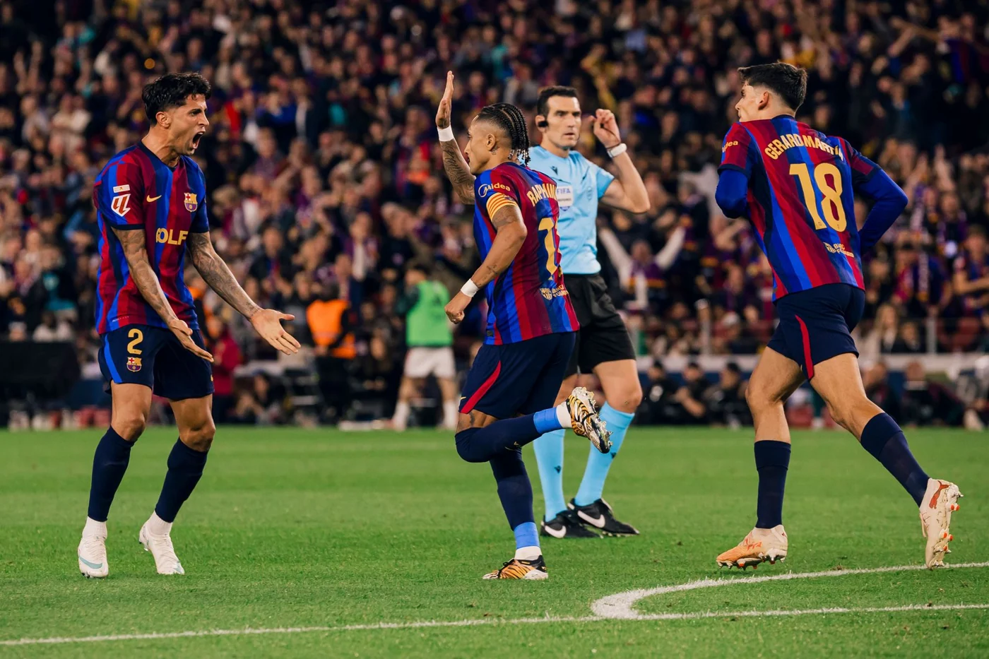 Raphinha and Barcelona teammates celebrate against Real Madrid