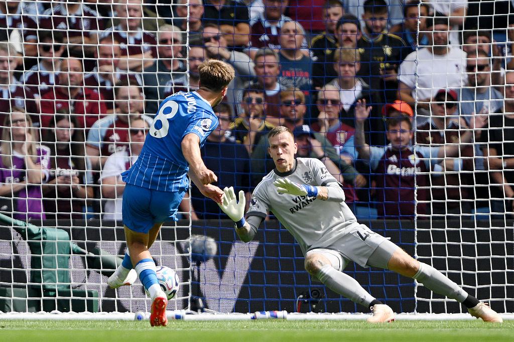 A Brighton player shoots on goal against Aston Villa