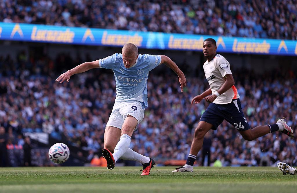 Erling Haaland strikes the ball for Manchester City against Coventry City