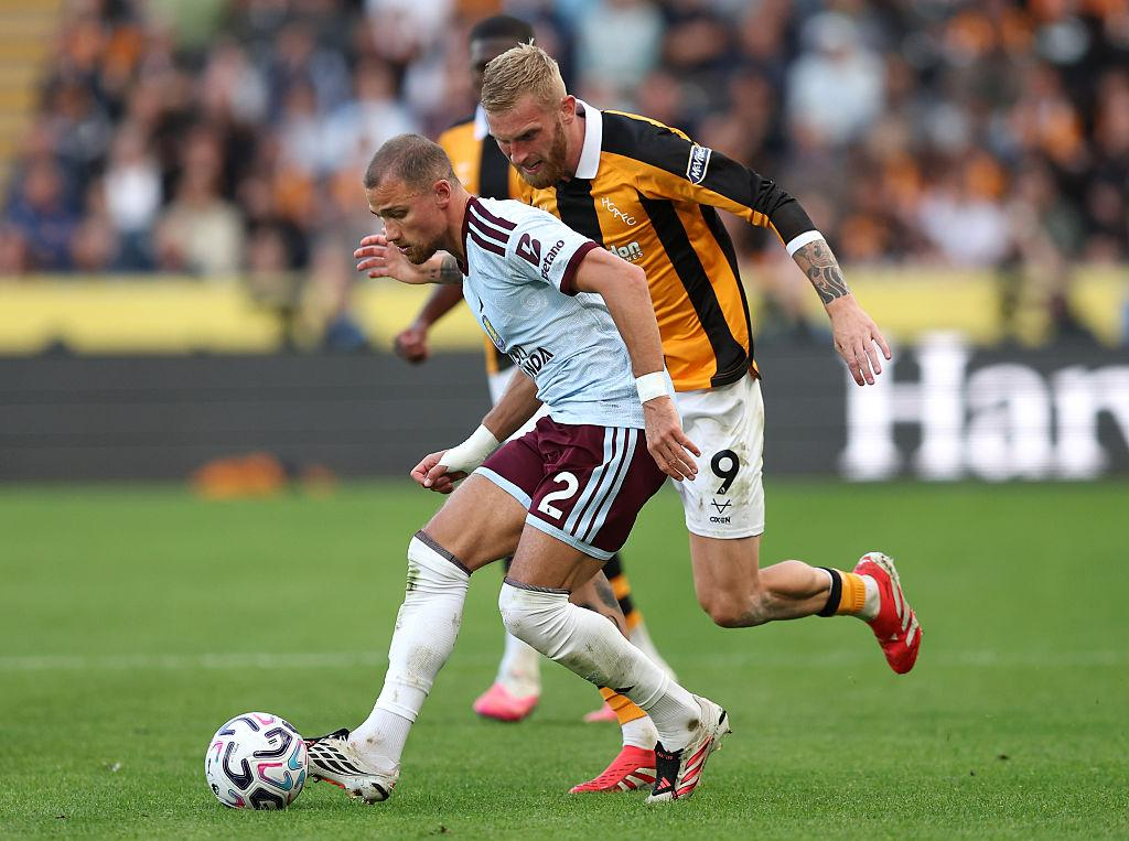 Aston Villa and Hull City players contest the ball