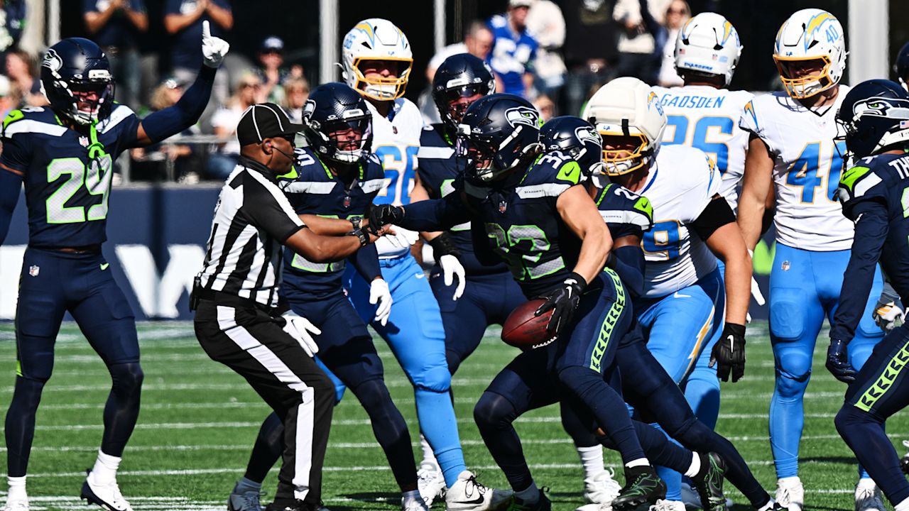 Seattle defenders gather around the football during their Week 4 home game against the Chargers