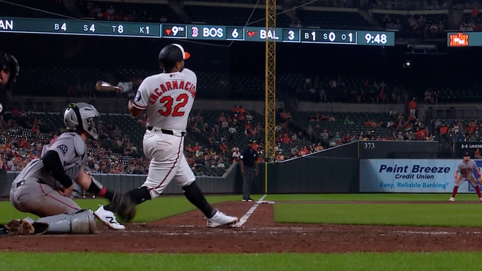 Christian Encarnacion-Strand follows through on a ninth-inning swing for the Baltimore Orioles against the Boston Red Sox
