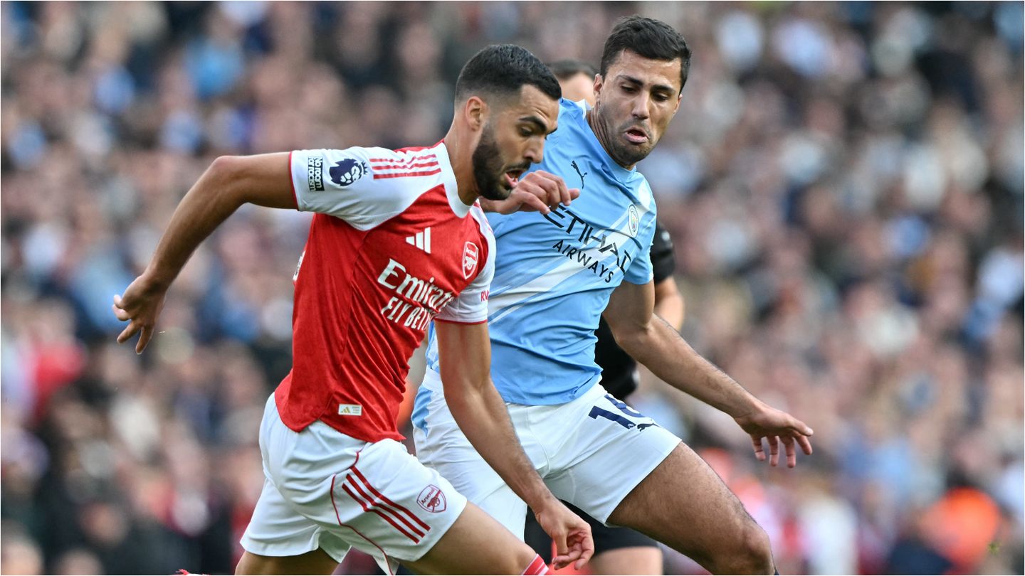 Arsenal's Mikel Merino battles Manchester City's Rodri during a Premier League match