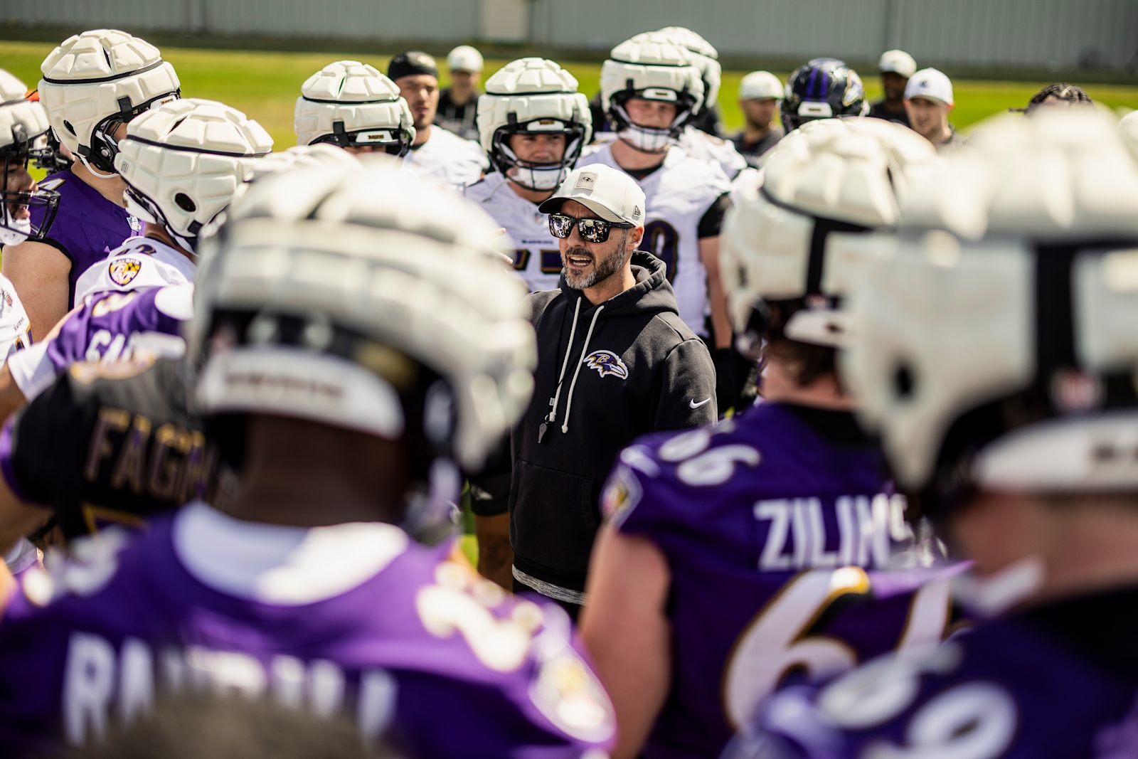 Ravens head coach Jesse Minter addresses players during the 2026 offseason program