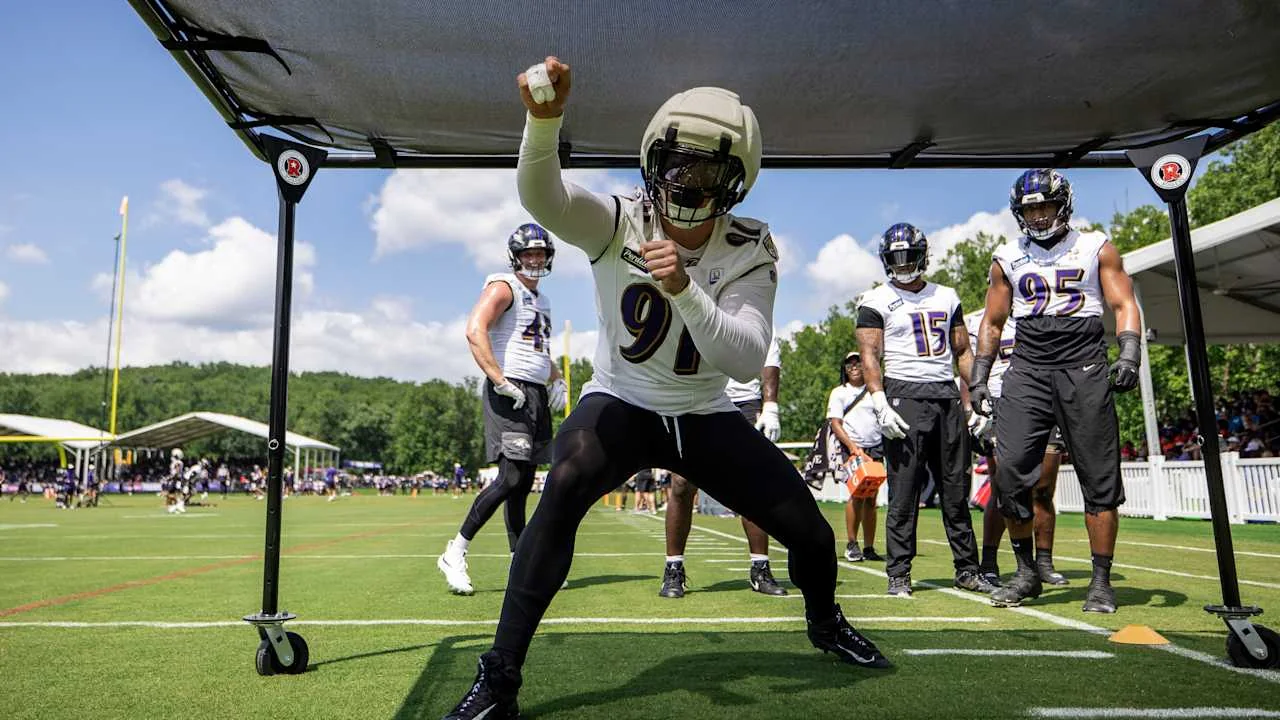 Trey Hendrickson works through a training-camp drill