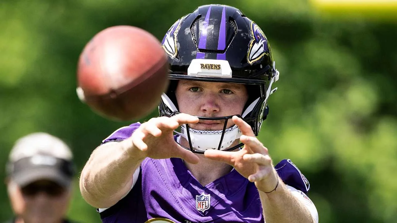 Ryan Eckley throws a football during Ravens minicamp