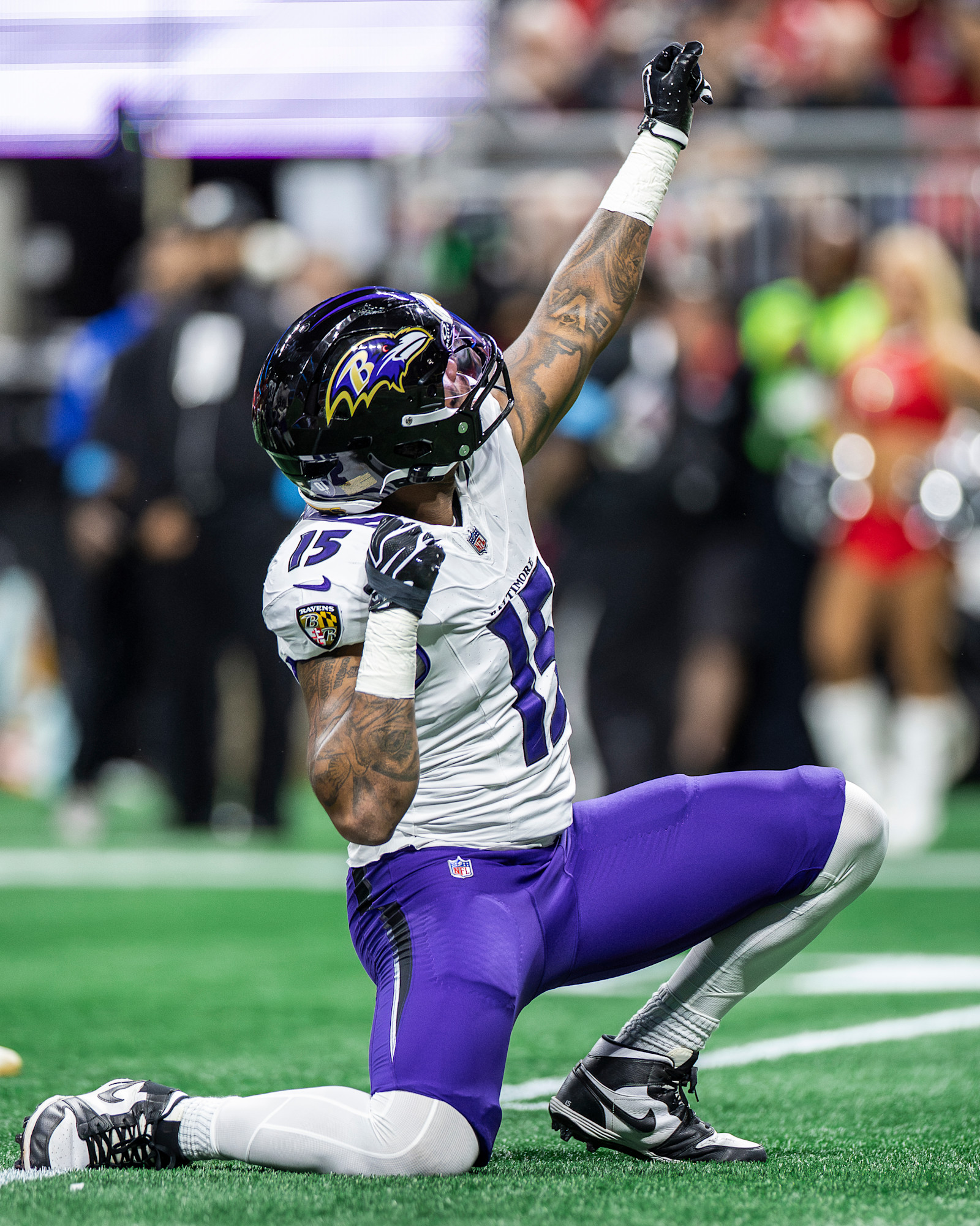 Malaki Starks gestures on the field against the Falcons