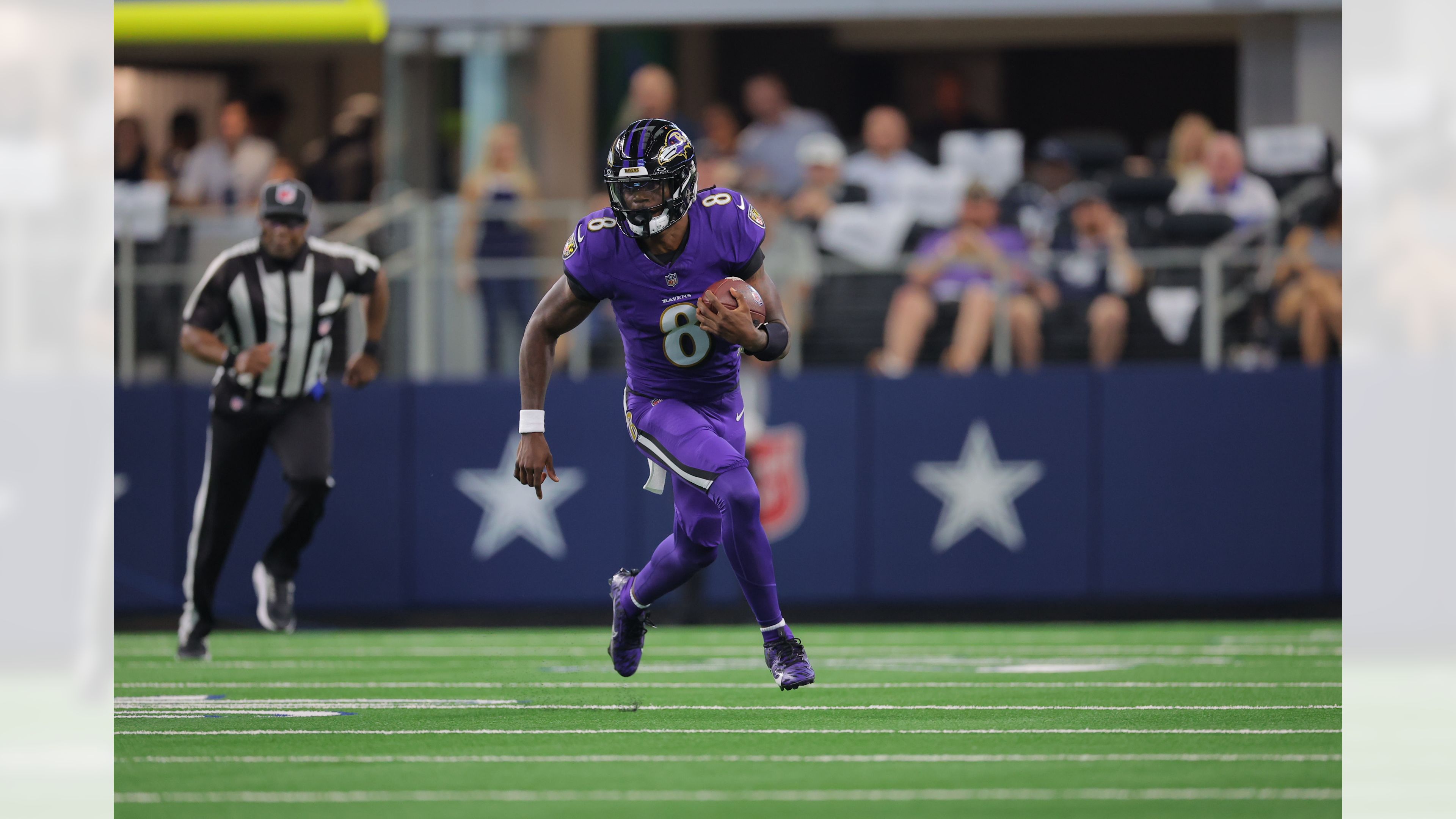 Lamar Jackson runs with the football against the Cowboys in Week 3