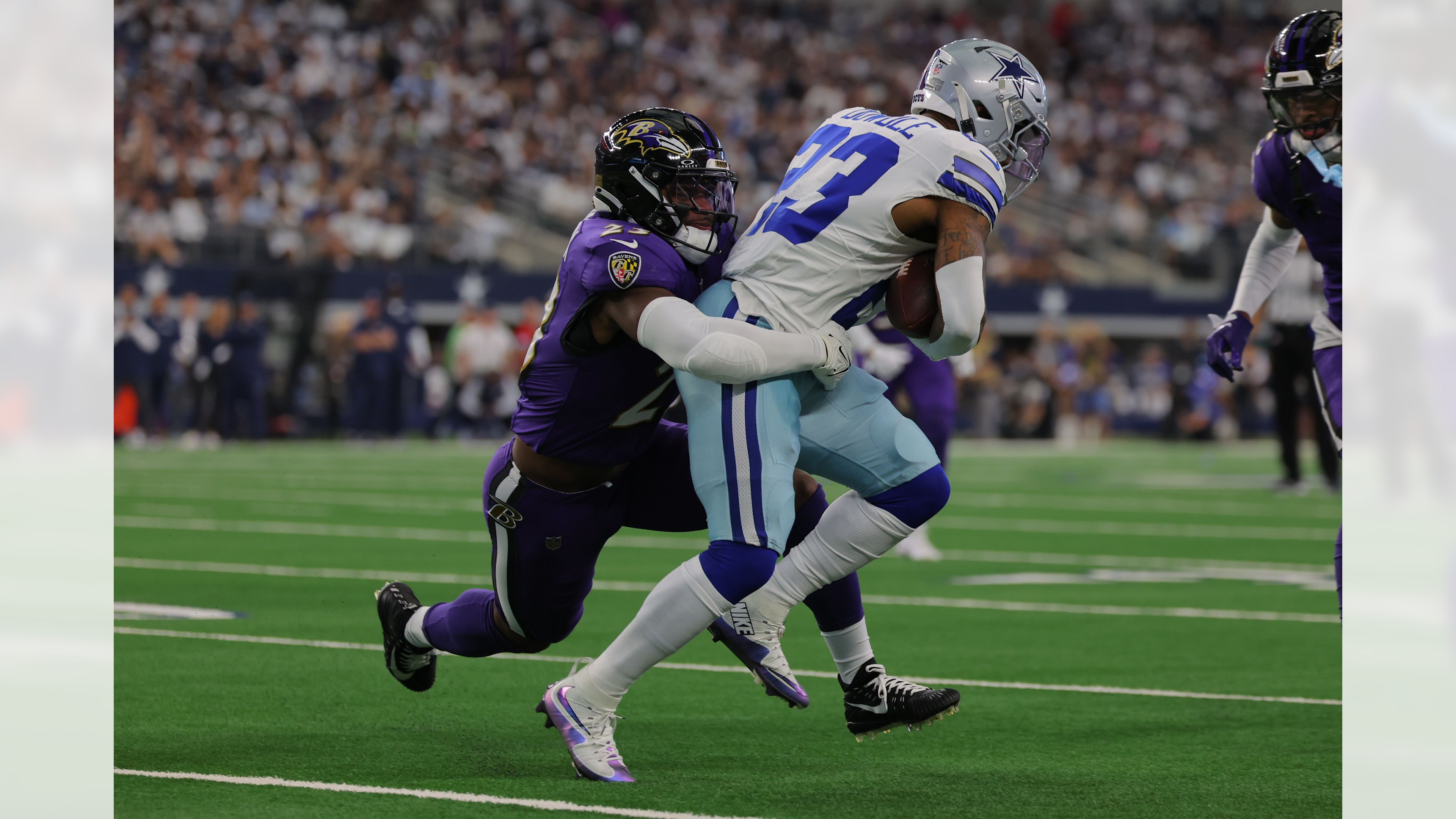 A Ravens defender tackles a Cowboys ball carrier during the Week 3 game in Rio