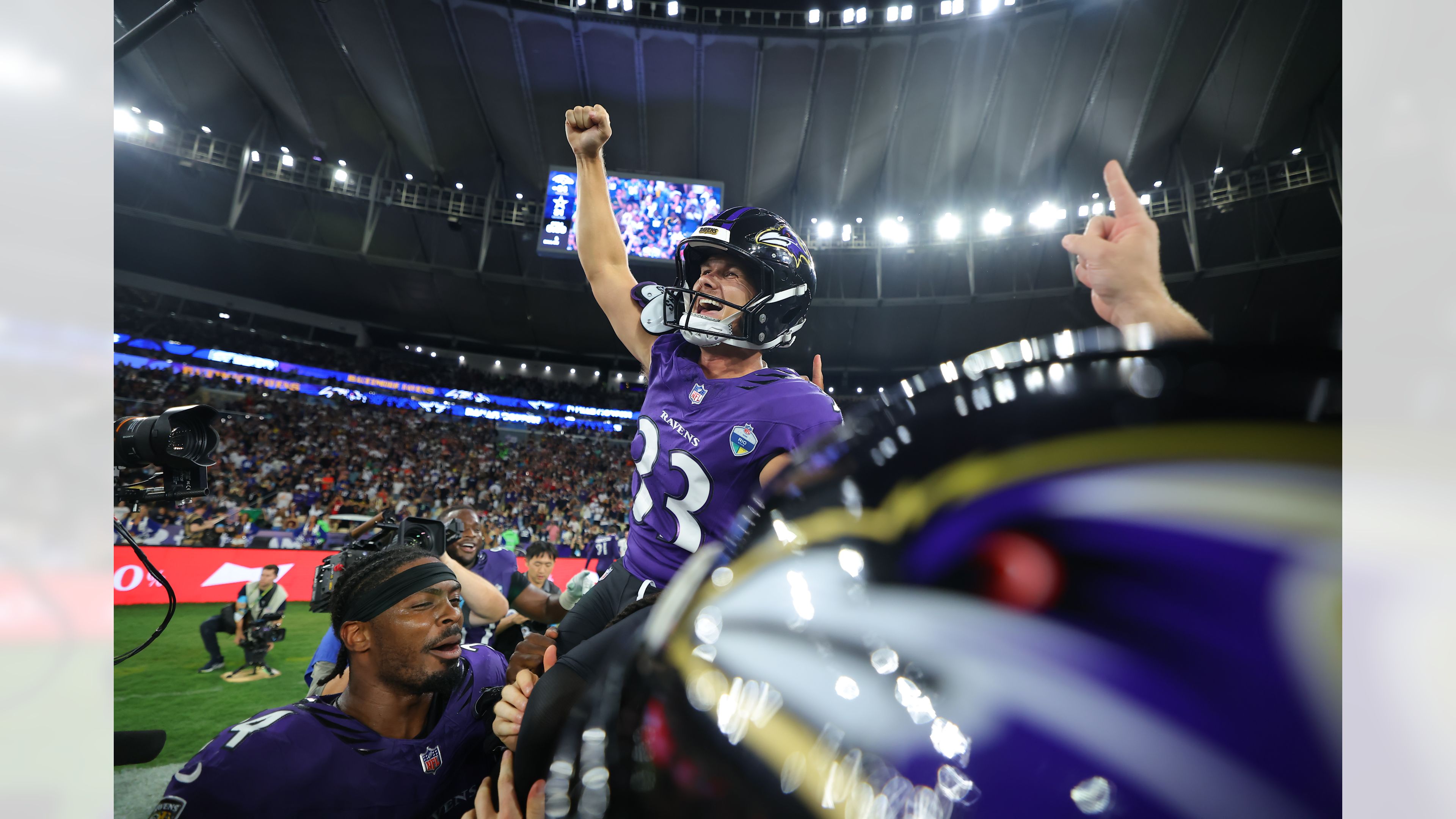 Tyler Loop celebrates with Ravens teammates after his game-winning kick against the Cowboys in Rio