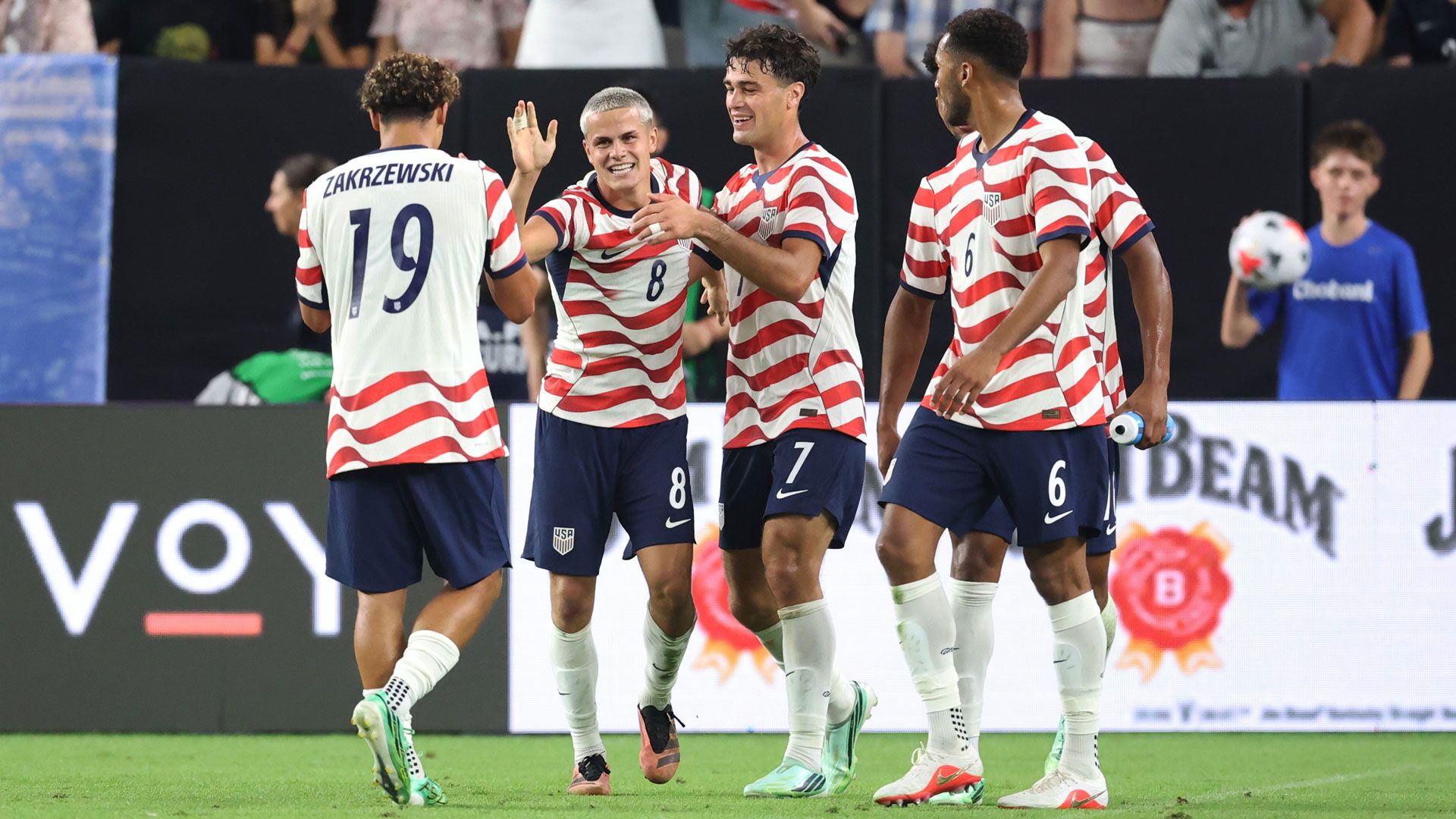 U.S. players celebrate together against Mexico