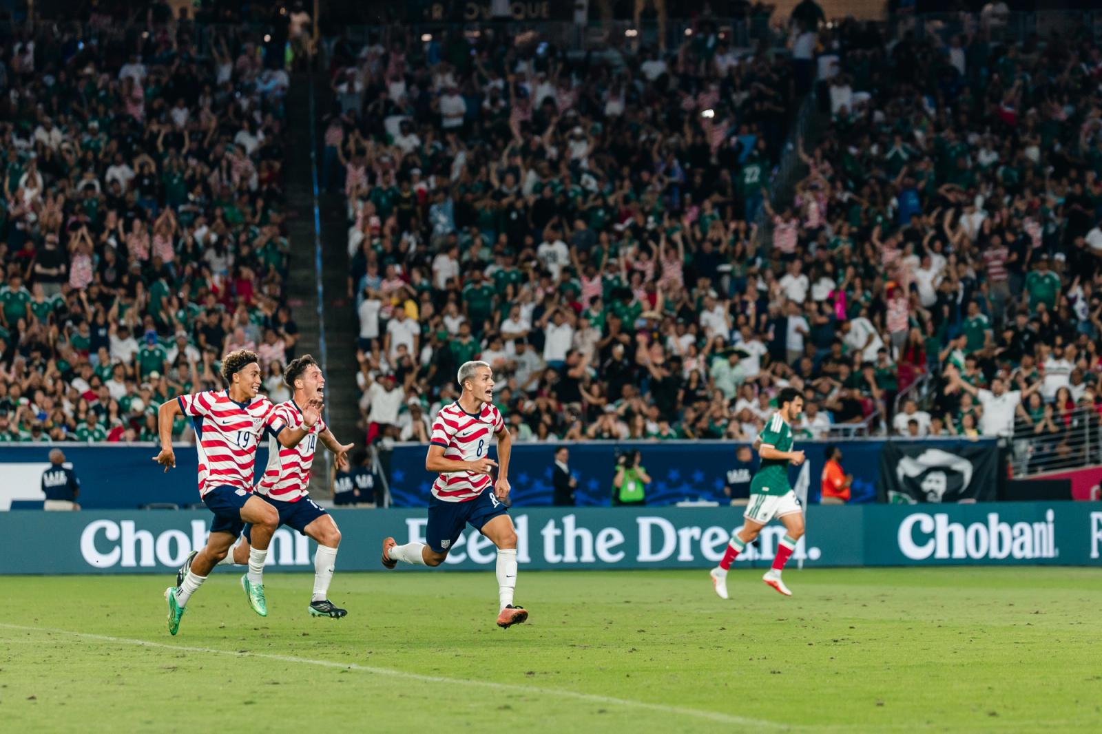 Cavan Sullivan celebrates his goal against Mexico with Julian Hall and Sebastian Berhalter